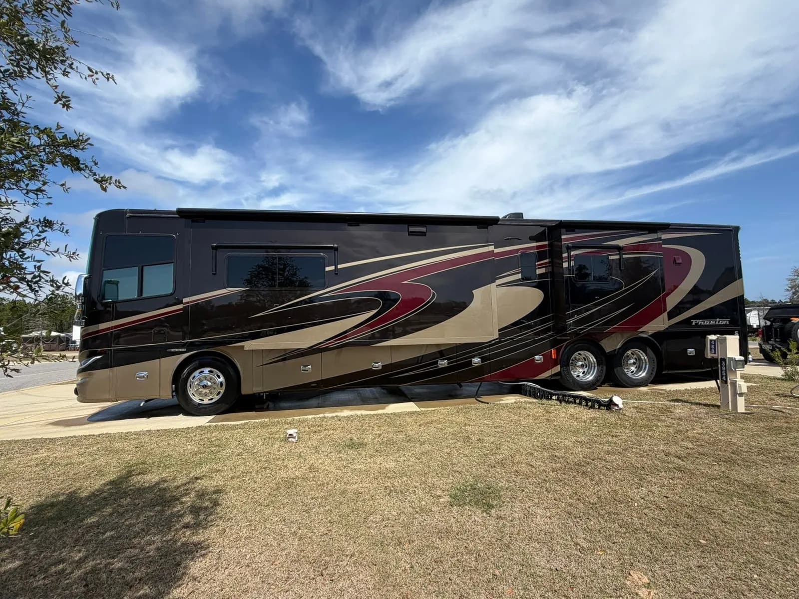 Class A motorhome parked at a campground after an exterior wash and wax